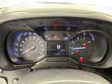 a close up of a car dashboard with a speedometer and gauges