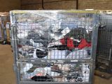 a large metal cart with a lot of clothes inside of it