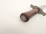 a small hammer that is on a white surface