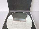 a box with a mirror inside of it on a table