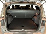 the back of a car with the trunk open and the seats down