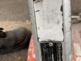a close up of a parking meter on the ground