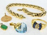 a lot of jewelry that is laying out on a table