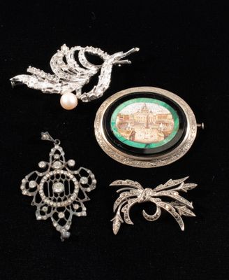 three pieces of jewelry including a broochet, a broochet and a broochet