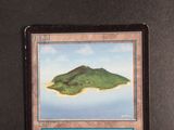 a card with a picture of a small island on it