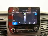 a picture of a car dashboard with a cell phone in it