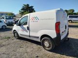 a white van that is parked in a parking lot