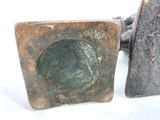 two pieces of metal that are sitting next to each other