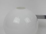 a white vase that is sitting on a table