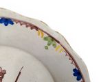 a plate with a picture of a man riding a horse