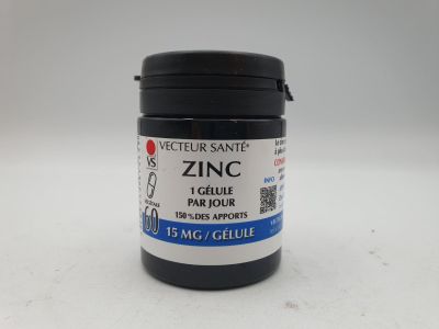 un gros plan sur un pot de peinture posé sur une surface blanche