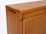 a wooden cabinet with a drawer on top of it