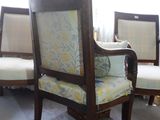 four chairs that are sitting in a room together