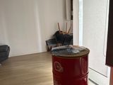 a red barrel sitting in the middle of a living room