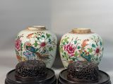 pair of chinese vases with birds and flowers painted on them