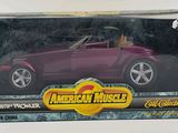 an image of a purple toy car in a box on a white surface