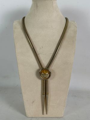 necklace made of metal and glass with a long brass chain