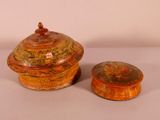 pair of red and yellow pottery containers with lids