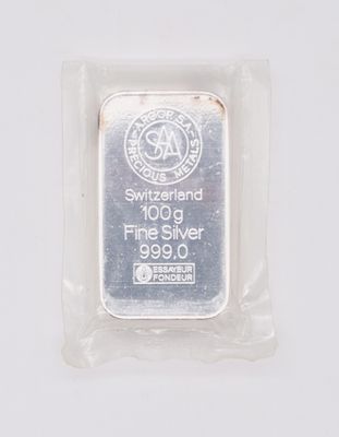 a close up of a silver bar in a package on a white surface