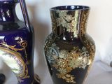 two vases sitting next to each other on a table