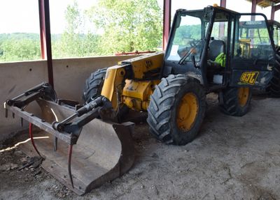 a picture of a construction vehicle parked in a garage