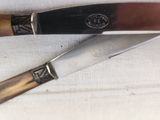 a knife and a knife holder on a table