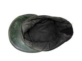 a black hat with a green patch on it