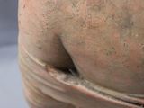 a close up of a statue of a man with a tie around his neck