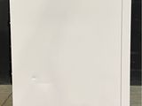 an image of a white refrigerator with a blue sticker on it
