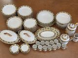 many different types of porcelain dishes and cups on the table