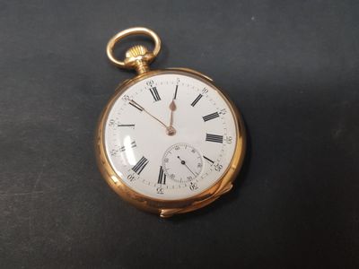 an antique pocket watch with roman numerals on a black surface