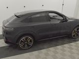 porsche cayense coupe in a showroom with a checkered floor