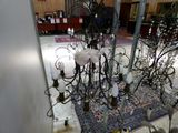 a chandelier that has a lot of lights hanging from it