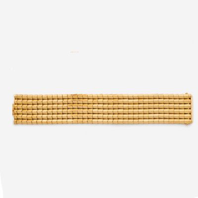 a close up of a gold bracelet on a mannequin mannequin mannequin mannequin mannequin mannequin mannequin manne