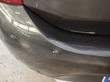 a close up of a car ' s bumper with a sticker on it
