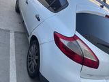 a white car parked on the side of the street