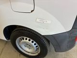 a close up of a white van with black rims