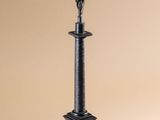 a statue of a man standing on top of a pedestal