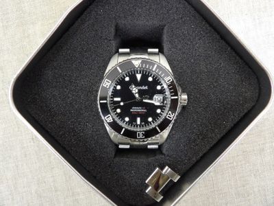 a watch that is in a box on a table