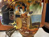 a lamp that has a picture of a woman on it