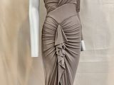 an image of a mannequin wearing a dress on a stand