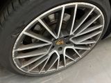 a close up of a tire on a car in a garage