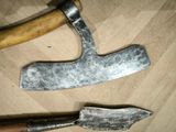 two different types of knives on a wooden table
