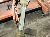 a machine that is working on a piece of wood