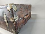 an old suitcase sitting on a table with a white background