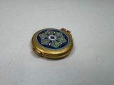 an image of a blue and gold pocket watch on a white surface