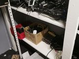 a lot of electronics on the shelves in the room