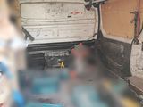 a white van with a blue seat in the back of it