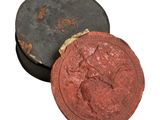 une image représentant un cachet de cire rouge orné d'un cheval