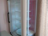 a glass case with a plate inside of it
